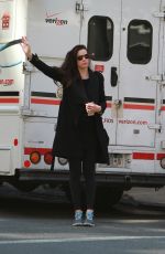 LIV TYLER Hailing for Taxi in New York