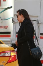LIV TYLER Hailing for Taxi in New York