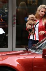 MICHELLE HUNZIKER and Tomaso Trussardi Drive Their Porsche Out in Milan