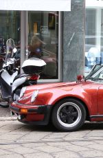 MICHELLE HUNZIKER and Tomaso Trussardi Drive Their Porsche Out in Milan