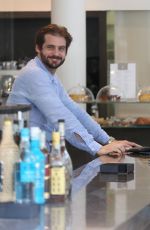MICHELLE HUNZIKER and Tomaso Trussardi Drive Their Porsche Out in Milan