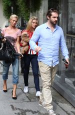 MICHELLE HUNZIKER and Tomaso Trussardi Drive Their Porsche Out in Milan