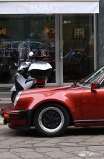 MICHELLE HUNZIKER and Tomaso Trussardi Drive Their Porsche Out in Milan