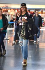 RIHANNA in Ripped Jeans at JFK Airport 04/30/2015