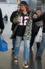 RIHANNA in Ripped Jeans at JFK Airport 04/30/2015