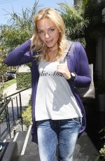 ALOISE MUMFORD Leaves a Clothing Store in Beverly Hills