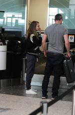 CARA DELEVINGNE at Heatrow Airport in London 06/29/2015