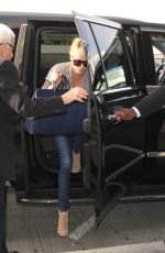 CHARLIZE THERON Arrives at LAX Airport in Los Angeles 06/07/2015