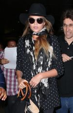 CHRISSY TEIGEN at Los Angeles International Airport 06/28/2015