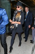 CHRISSY TEIGEN at Los Angeles International Airport 06/28/2015