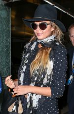 CHRISSY TEIGEN at Los Angeles International Airport 06/28/2015