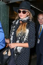 CHRISSY TEIGEN at Los Angeles International Airport 06/28/2015