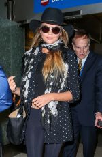 CHRISSY TEIGEN at Los Angeles International Airport 06/28/2015