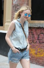 DAKOTA FANNING in Jeans Shorts Out in Soho 06/23/2015