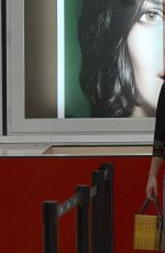 DAKOTA JOHNSON at Barcelona–el Prat Airport in Barcelona