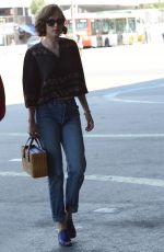 DAKOTA JOHNSON at Barcelona–el Prat Airport in Barcelona