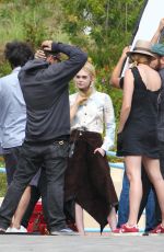 ELLE FANNING on the Set of a Photoshoot in Malibu 06/17/2015