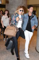 GIGI HADID Arrives at Airport in Toronto 06/20/2015