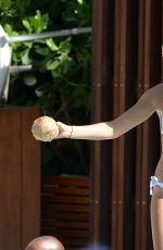 HAILEY BALDWIN in Bikni at a Pool in Miami 06/12/2015