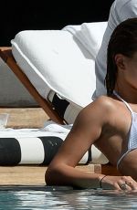 HAILEY BALDWIN in Bikni at a Pool in Miami 06/12/2015