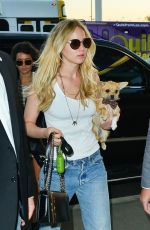 JENNIFER LAWRENCE in Jeans at Los Angeles International Airport