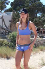 KIMBERLEY GARNER in Shorts and Tank Top Working on the Beach in Ibiza