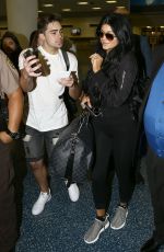 KYLIE JENNER Arrives at Miami International Airport 06/19/2015