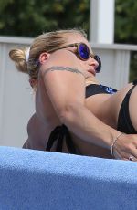 MICHELLE HUNZIKER in Bikini on Vocation at a Beach in Italy 06/16/2015