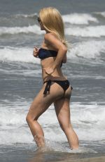 MICHELLE HUNZIKER in Bikini on Vocation at a Beach in Italy 06/16/2015