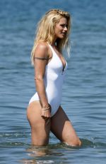 MICHELLE HUNZIKER in Swimsuit and Bikini at a Beach at Forte Dei Marmi