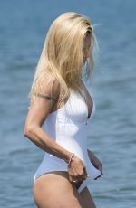 MICHELLE HUNZIKER in Swimsuit and Bikini at a Beach at Forte Dei Marmi