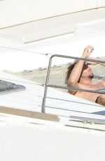 NIKKI REED in Swimsuit at a Boat in Italy 06/25/2015