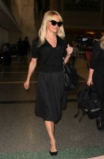 PAMELA ANDERSON at LAX Airport in Los Angeles 06/16/2015