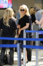 PAMELA ANDERSON at LAX Airport in Los Angeles 06/16/2015