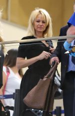 PAMELA ANDERSON at LAX Airport in Los Angeles 06/16/2015