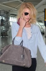 ROSIE HUNTINGTON-WHITELEY at Heathrow Airport in London 06/05/2015