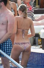 STEPHANIE WARING and JUDE CISSE in Bikinis at a Pool in Mmarbella