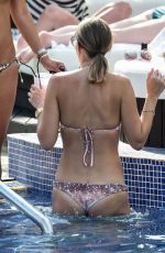 STEPHANIE WARING and JUDE CISSE in Bikinis at a Pool in Mmarbella