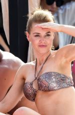 STEPHANIE WARING and JUDE CISSE in Bikinis at a Pool in Mmarbella