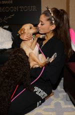 ARIANA GRANDE Plays with Dogs in New York