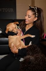 ARIANA GRANDE Plays with Dogs in New York