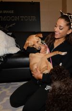 ARIANA GRANDE Plays with Dogs in New York