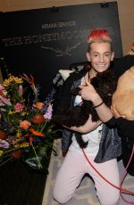 ARIANA GRANDE Plays with Dogs in New York