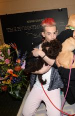 ARIANA GRANDE Plays with Dogs in New York