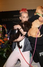 ARIANA GRANDE Plays with Dogs in New York