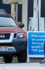 CHARLIZE THERON at Arco Gas Station in Los Angeles
