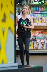 CHARLIZE THERON at Arco Gas Station in Los Angeles