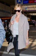 CHARLIZE THERON at Los Angeles International Airport 07/12/2015
