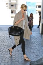 CHARLIZE THERON at Los Angeles International Airport 07/12/2015