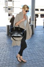 CHARLIZE THERON at Los Angeles International Airport 07/12/2015